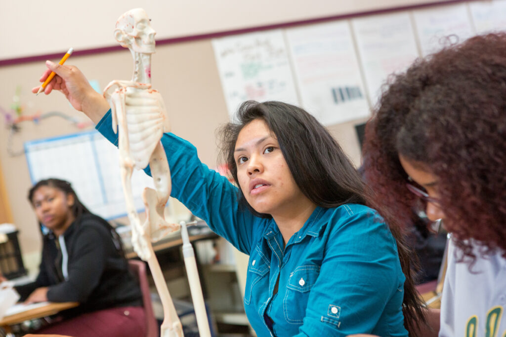 High school girl raising her hand